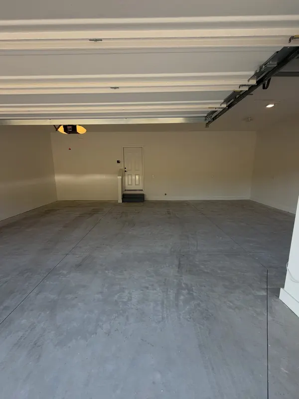 Before: Two-car garage concrete before coating