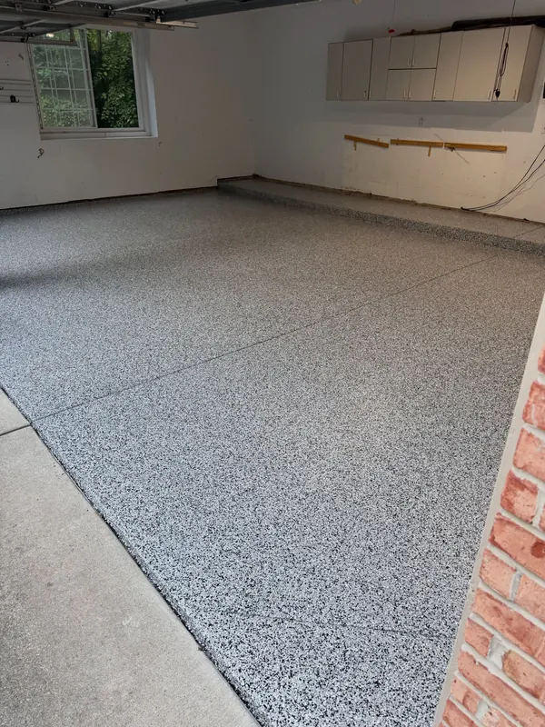 After: Same garage after coating in gray flake