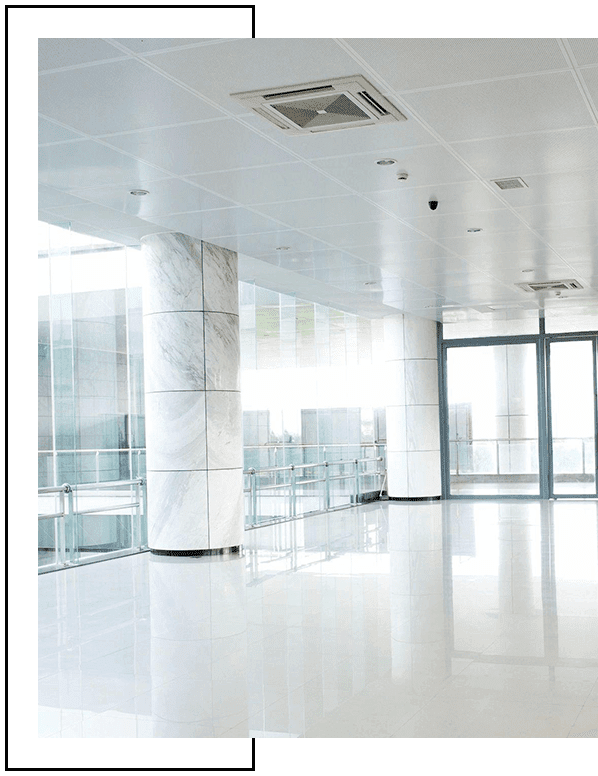 A large white room with glass doors and windows.