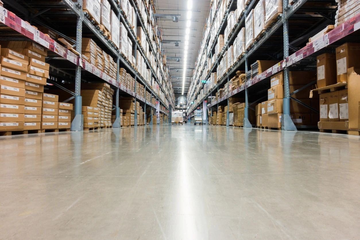 A warehouse filled with lots of boxes and shelves.